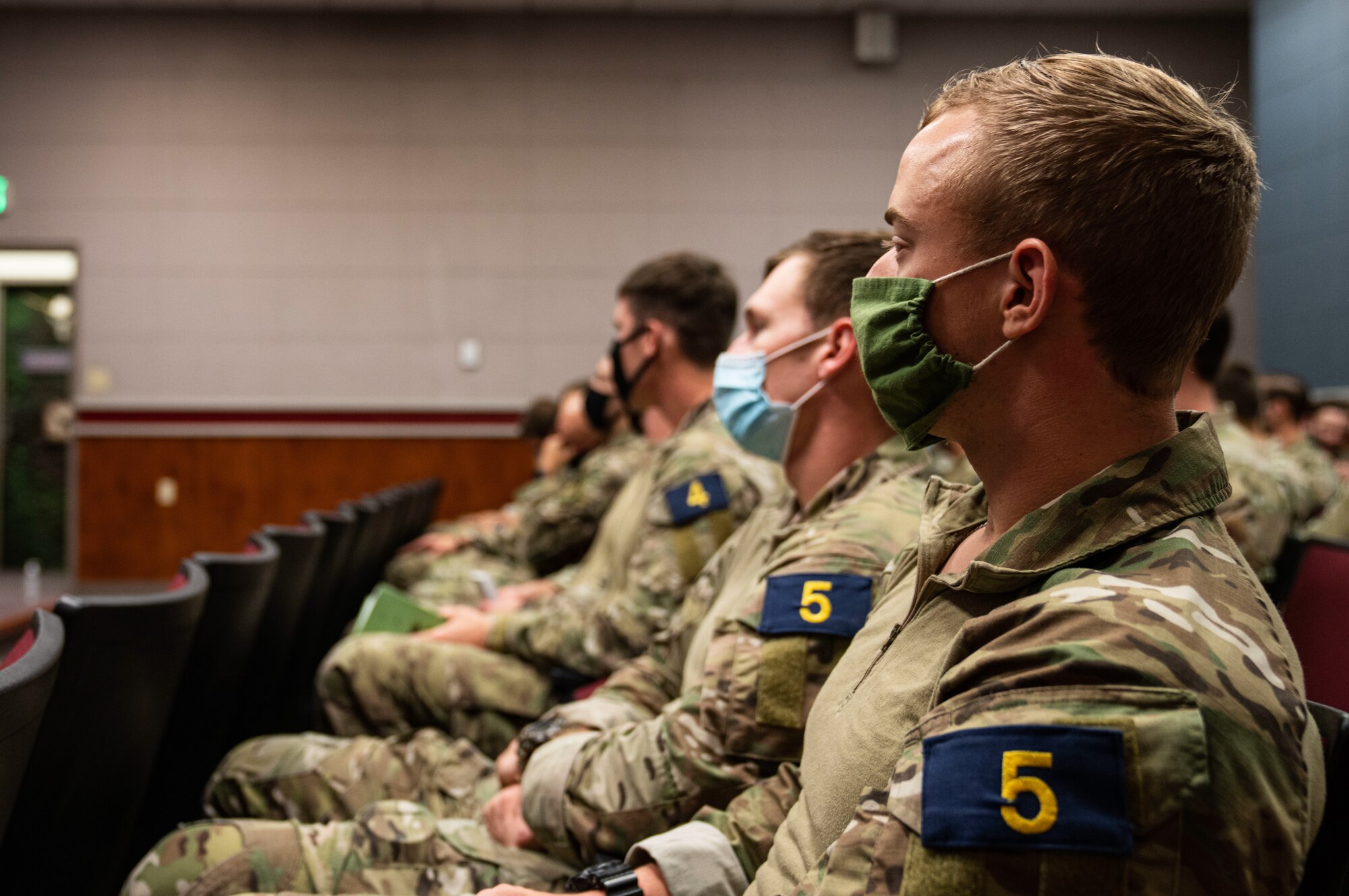 Airmen receiving a briefing