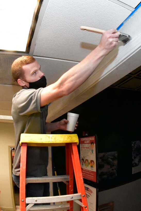 Zachary Pooler, 75th Force Support Squadron food service specialist, paints the interior of a dining facility Oct. 27, 2020, during a self-help renovation project on Hill Air Force Base, Utah. The DFAC facelift work is being accomplished by food service staff and many volunteer Airman from various squadrons across the base. (U.S. Air Force photo by Todd Cromar)