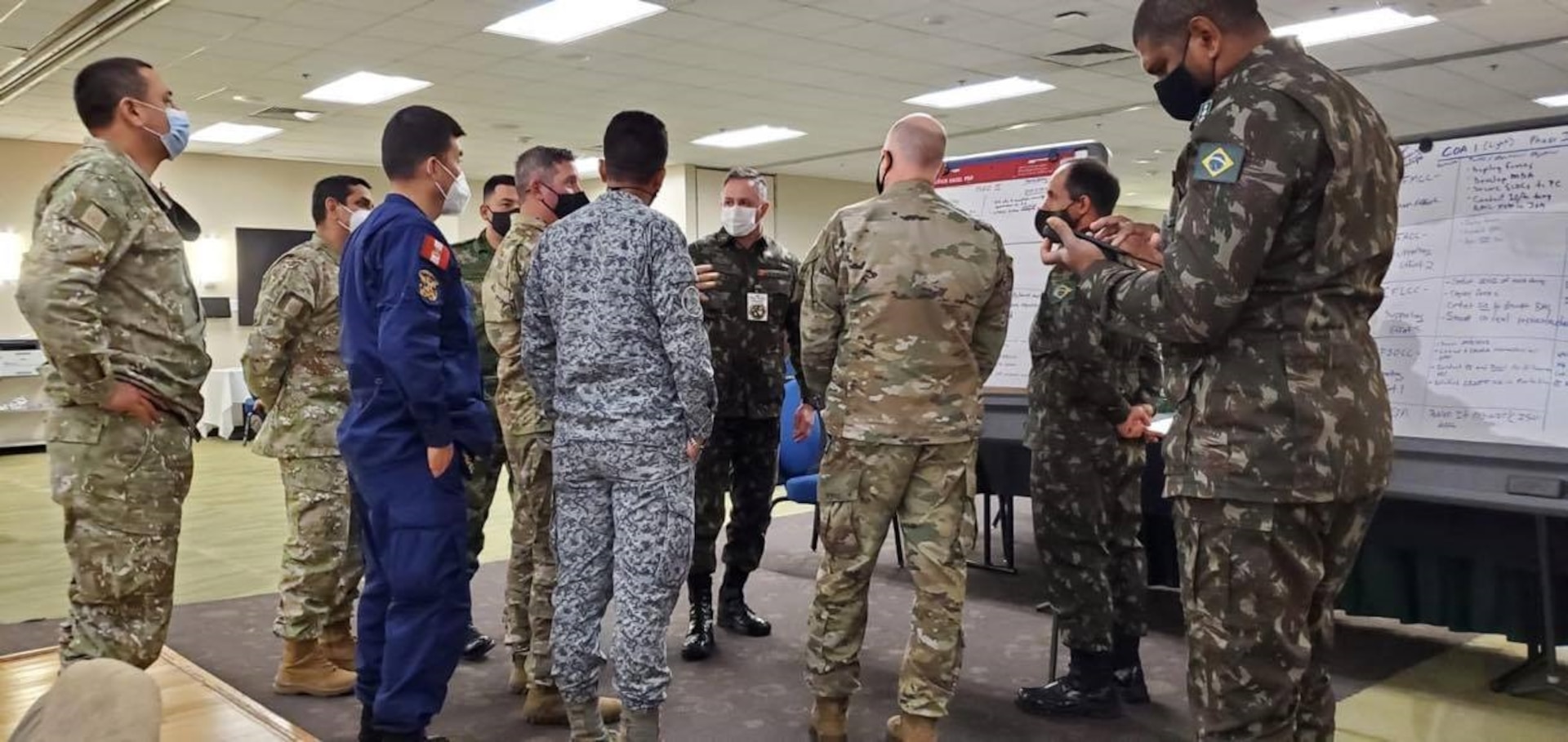 Military officers from Brazil, Colombia and Peru conduct mission analysis as part of the Planning in Crisis exercise Oct. 28 hosted by U.S. Army South and held at Joint Base San Antonio-Fort Sam Houston Oct. 26-30. The exercise allowed partner nations from the Western Hemisphere to plan and develop an operation order with component commands in preparation for the U.S. Southern Command PANAMAX exercise.