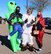 Eric McCullough, left, 50th Force Support Squadron community cohesion coordinator, Joe Montoya, center, 50th FSS visual assistant, and Jennifer Anthony, 50th FSS commercial sponsorship coordinator, get in the spirit of Halloween by wearing costumes to the 50th FSS trunk decorating contest at Schriever Air Force Base, Colorado on Oct. 30, 2020. The event provided pre-packaged candy, hot cocoa and free caramel apples to attendees. (U.S. Space Force photo by Marcus Hill)