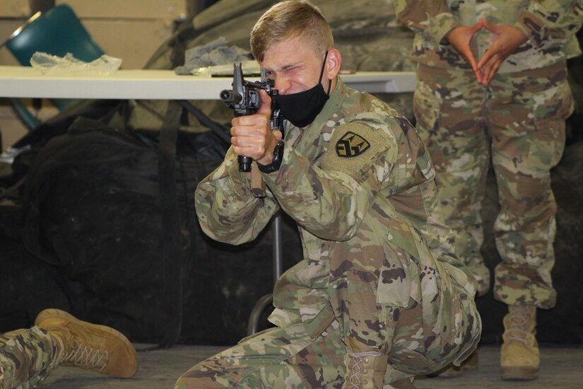 Spc. Brian Hartman, a generator mechanic assigned to the 377th Theater Sustainment Command, aims at a target during primary marksmanship instruction in Belle Chasse, Louisiana, October 25, 2020.