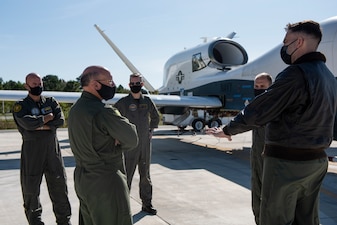 NAVAL AIR STATION PATUXENT RIVER, Md. (Nov. 3, 2020) Chief of Naval Operations (CNO) Adm. Mike Gilday is briefed on the MQ-4C Triton Unmanned Air System during a tour of Naval Air Station Patuxent River. (U.S. Navy photo by Mass Communication Specialist 1st Class Raymond D. Diaz III/Released)