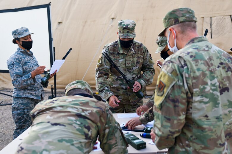 Airmen signing for radio equipment