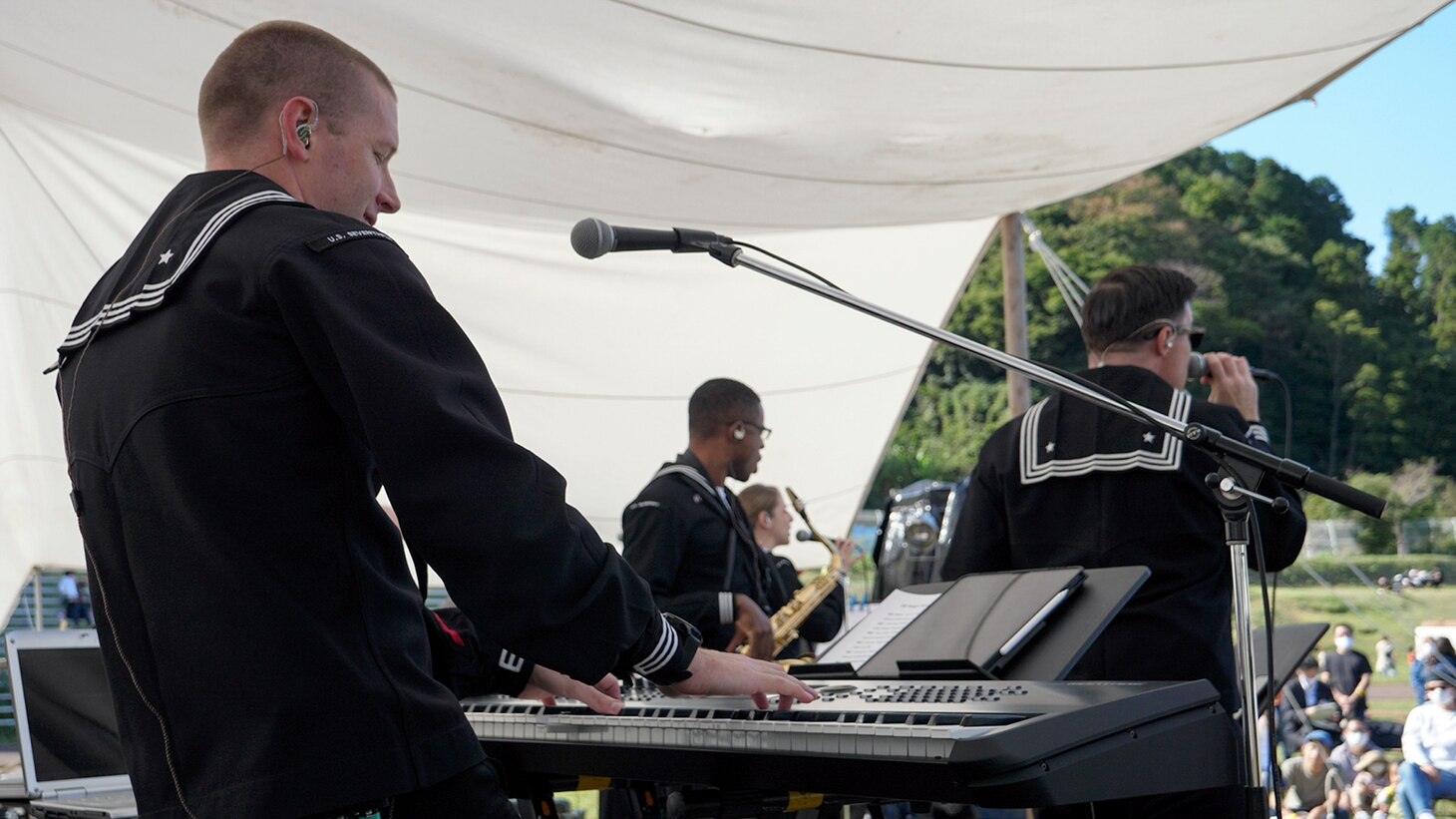 IKEGO, Japan - Musicians with the U.S. 7th Fleet Band Orient Express Popular Music Group play at the Ikego Forest Music Festival at Ikego Natural Forest Park Oct. 24, 2020. The 7th Fleet Band, established in 1948, provides musical support for ships, military bases, foreign dignitaries, and many community relations events throughout the Indo-Pacific.