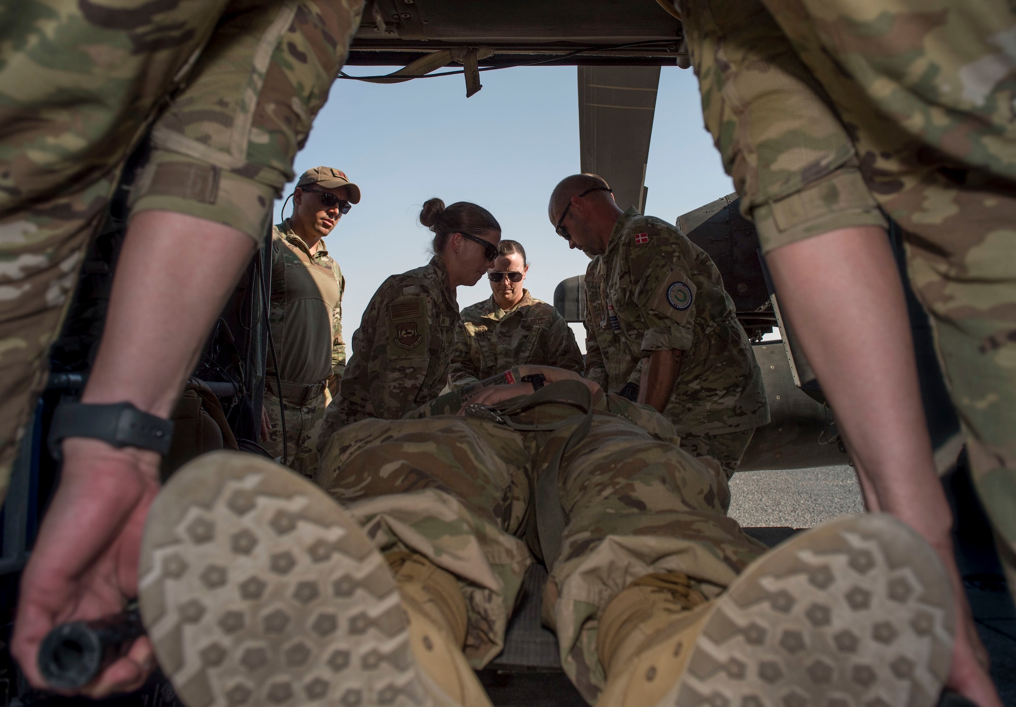Medical personnel load a patient onto a UH-60 Black Hawk helicopter during a medical evacuation training exercise at Ali Al Salem Air Base, Kuwait, Oct. 27, 2020.