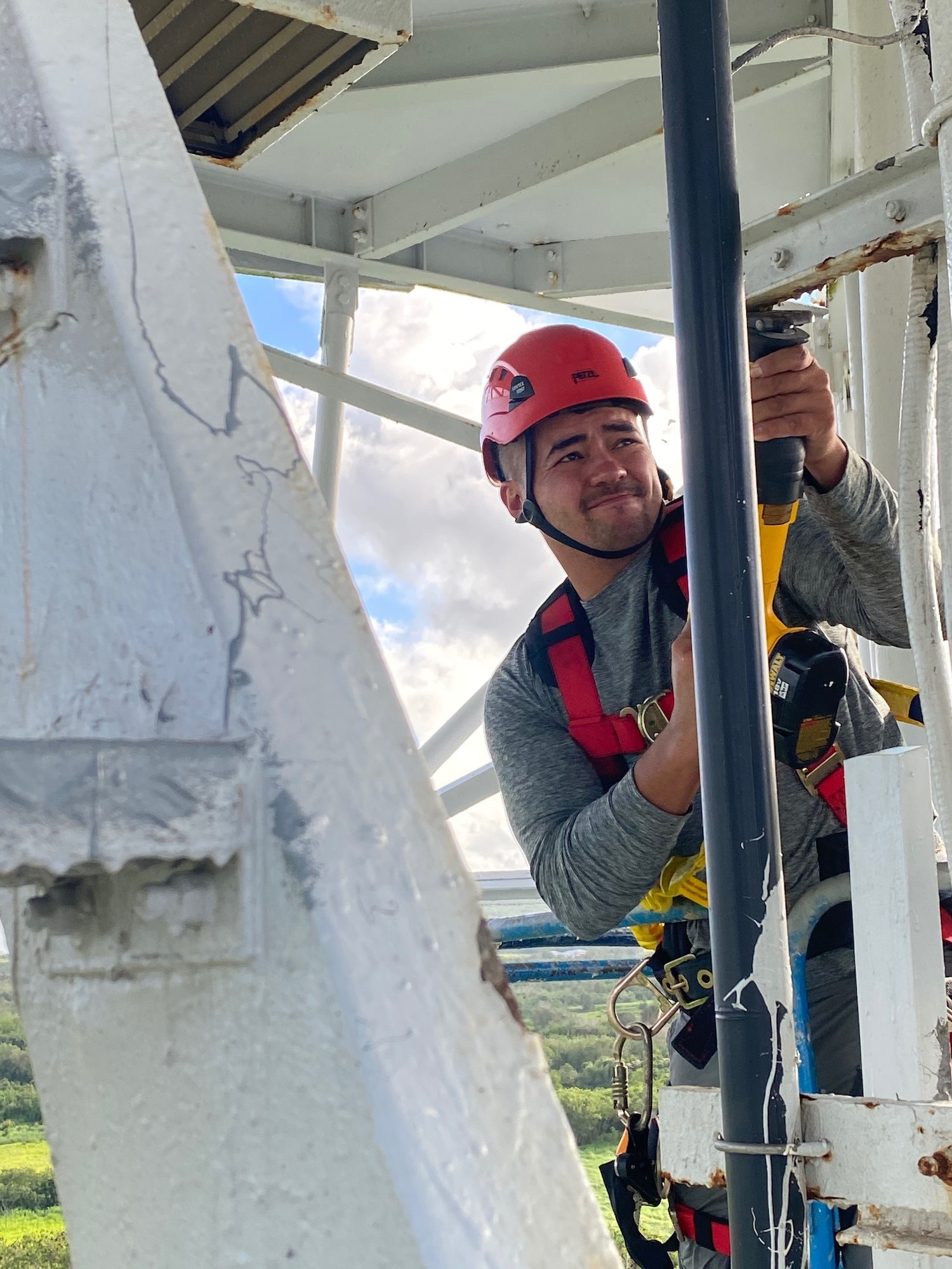 Tech. Sgt. Michael Britt, assigned to the 36th Operation Support Squadron Radar, Airfield, & Weather Systems, works on removing the waveguide from the Next-Generation Radar, March 25, 2020 in Yigo, Guam. The waveguide is a 100-foot tube of pressurized air, which allows signals to pass between the station below and the radar above. (U.S. Air Force photo by Staff Sgt. Matthew Hawkins)