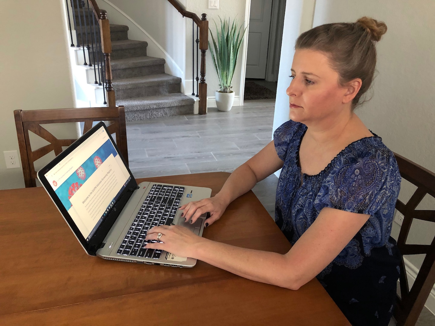 Marcy Edwards, a Military Health System beneficiary, signs up for Operation Warp Speed Nov. 2. Operation Warp Speed is a national initiative to accelerate the development, production and distribution of COVID-19 vaccines, therapeutics and diagnostics.