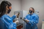 Alejandra Ornelas, Operation Warp Speed research pharmacy technician, documents and verifies whether a patient receives a vaccine or placebo, Oct. 28, 2020, at Joint Base San Antonio-Lackland, Texas. The U.S. Food and Drug Administration authorized the restart of AstraZeneca’s Phase 3 clinical trial, Oct. 26, 2020. (U.S. Air Force photo by Airman 1st Class Melody Bordeaux)