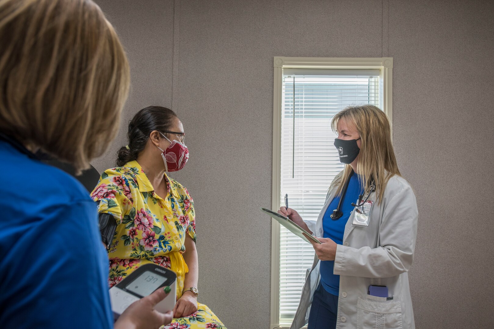 Sally Abare, Operation Warp Speed nurse practitioner, verifies a patient’s health history, Oct. 28, 2020, at Joint Base San Antonio-Lackland, Texas. Patients are evaluated and tested to determine their eligibility to participate in the vaccine clinical study. (U.S. Air Force photo by Airman 1st Class Melody Bordeaux)