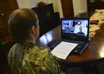 SINGAPORE (Nov. 4, 2020) – Capt. Ann McCann, commodore of Destroyer Squadron 7, listens to opening remarks during a virtual opening ceremony for Cooperation Afloat Readiness and Training (CARAT) Bangladesh 2020. This year marks the 26th iteration of CARAT, a multinational exercise designed to enhance U.S. and partner navies' abilities to operate together in response to traditional and non-traditional maritime security challenges in the Indo-Pacific region.