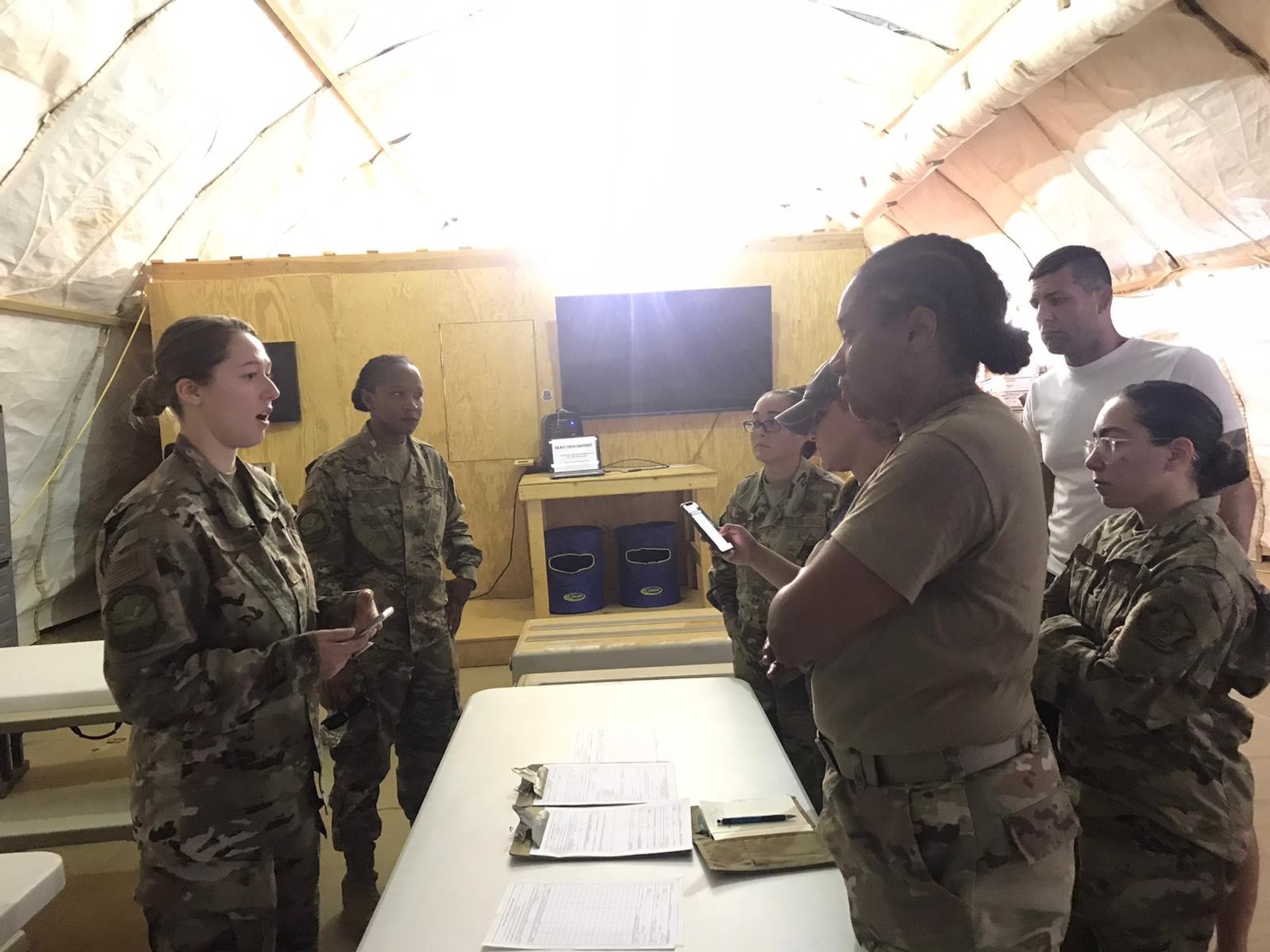 U.S. Airmen from the 768th Expeditionary Air Base Squadron Mortuary Affairs team exercises coordinating next of kin notifications with the Logistics Readiness Flight and Personnel Support for Contingency Operations during a short-notice Mortuary Affairs exercise at Nigerian Air Base 101, Niamey, Niger, Oct. 9, 2020.