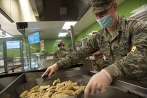 Airman 1st Class Samuel Puzak, 628th Force Support Squadron food services apprentice, prepares bento boxes at the Robert D. Gaylor Dining Facility at Joint Base Charleston, S.C., Nov. 2, 2020. Airmen and civilians who work at the dining facility work as part of a seven to 12 member team and serve meals to approximately 300 personnel during lunch hours. 628th FSS members ensure service members and civilians are fed at Joint Base Charleston, but feeding the force is just one mission that the FSS team is responsible for. The four core areas of services are food service, lodging, readiness, and fitness and sports.