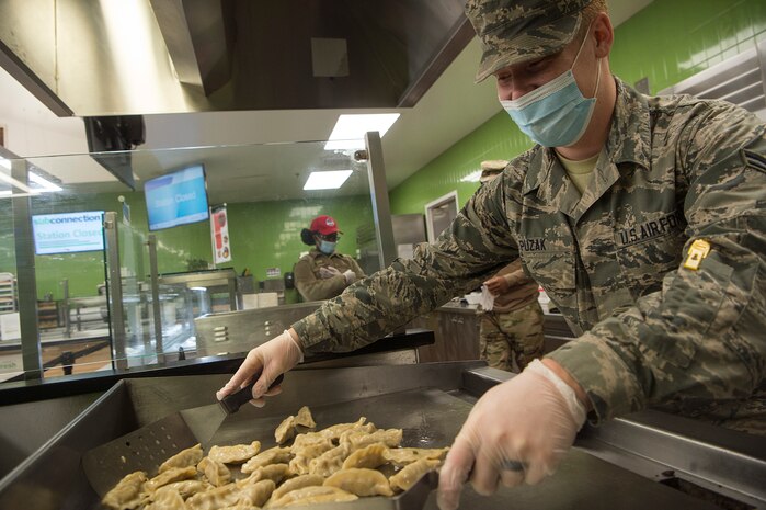 Airman 1st Class Samuel Puzak, 628th Force Support Squadron food services apprentice, prepares bento boxes at the Robert D. Gaylor Dining Facility at Joint Base Charleston, S.C., Nov. 2, 2020. Airmen and civilians who work at the dining facility work as part of a seven to 12 member team and serve meals to approximately 300 personnel during lunch hours. 628th FSS members ensure service members and civilians are fed at Joint Base Charleston, but feeding the force is just one mission that the FSS team is responsible for. The four core areas of services are food service, lodging, readiness, and fitness and sports.