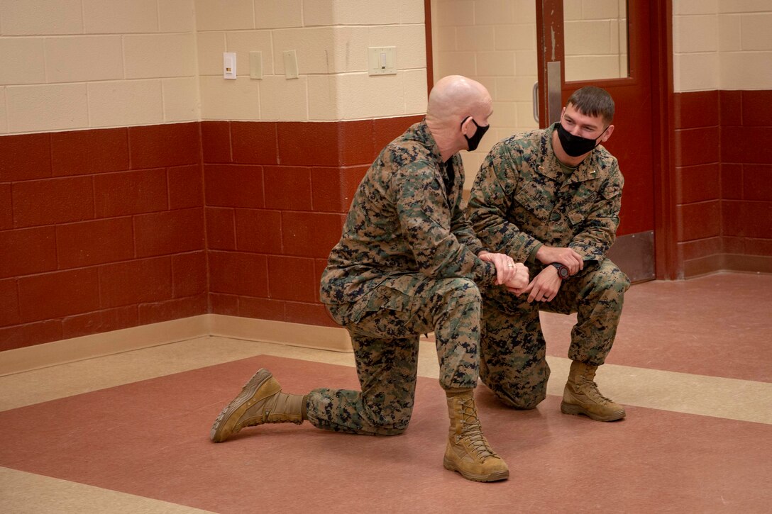 The 19th Sergeant Major of the Marine Corps, Sgt. Maj. Troy E. Black, speaks with Marines attending The Basic School at Marine Corps Base Quantico, V.A., Nov. 2, 2020. During the visit Black discussed the relationship between officers and Staff Non-Commissioned officers that creates strong command teams capable of leading Marines with high morale and motivation. The Basic School educates newly commissioned or appointed officers in the high standards of professional knowledge, esprit-de-corps, and leadership to prepare them for duty in the operating forces. (U.S. Marine Corps photo by Sgt. Victoria Ross)