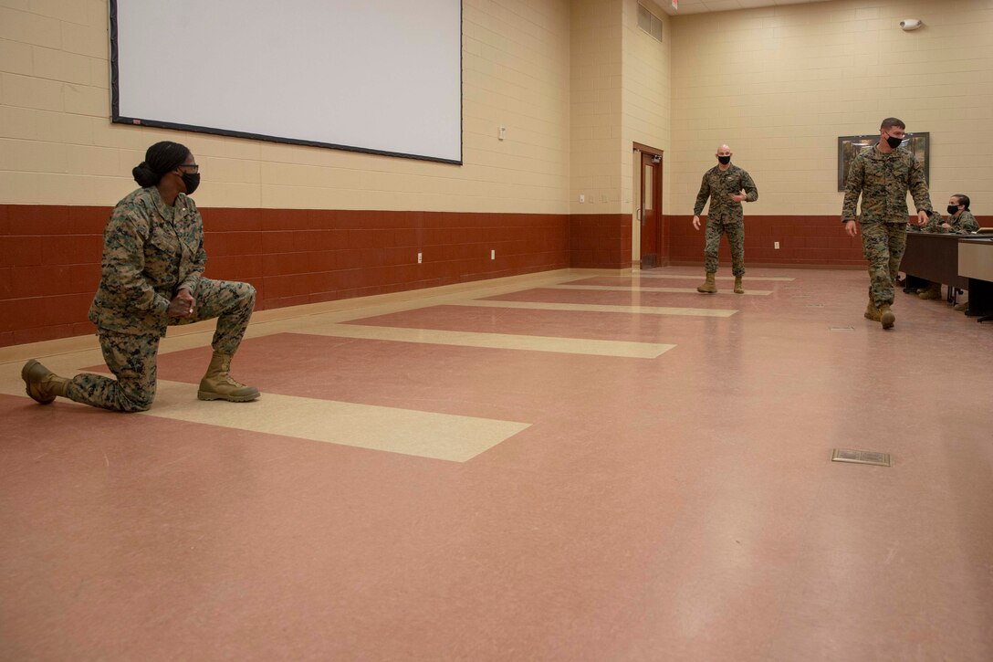 The 19th Sergeant Major of the Marine Corps, Sgt. Maj. Troy E. Black, speaks with Marines attending The Basic School at Marine Corps Base Quantico, V.A., Nov. 2, 2020. During the visit Black discussed the relationship between officers and Staff Non-Commissioned officers that creates strong command teams capable of leading Marines with high morale and motivation. The Basic School educates newly commissioned or appointed officers in the high standards of professional knowledge, esprit-de-corps, and leadership to prepare them for duty in the operating forces. (U.S. Marine Corps photo by Sgt. Victoria Ross)