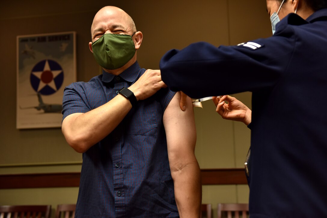 U.S. Air Force Col. Andres Nazario, 17th Training Wing commander, receives his flu vaccine while on leave to begin the flu shot dispersal to active duty members at the Norma Brown Building on Goodfellow Air Force Base, Texas, Nov. 2, 2020. Active duty members received their shot at the headquarters building or the Ross Clinic. (U.S. Air Force photo by Staff Sgt. Seraiah Wolf)