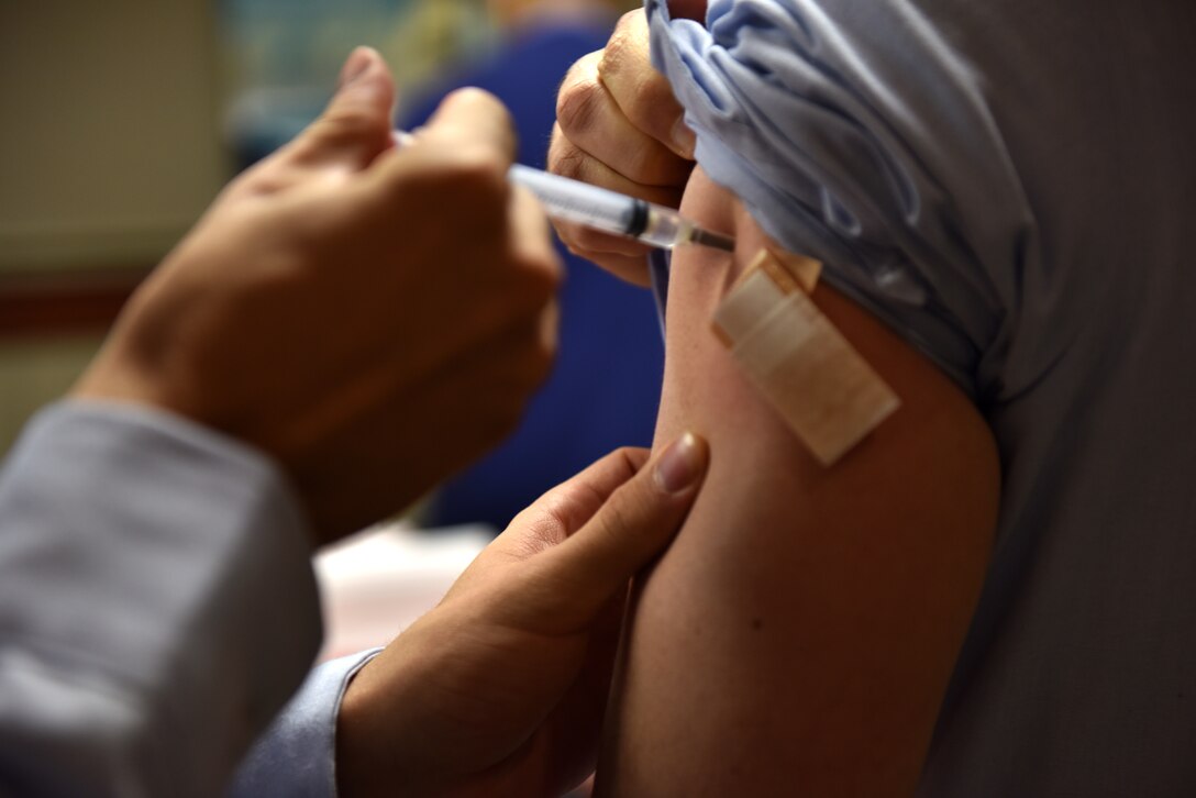 A Goodfellow member receives their flu vaccine during the initial dispersal at the Norma Brown Building on Goodfellow Air Force Base, Texas, Nov. 2, 2020. Active duty members received their shots before dependents and retirees. (U.S. Air Force photo by Staff Sgt. Seraiah Wolf)