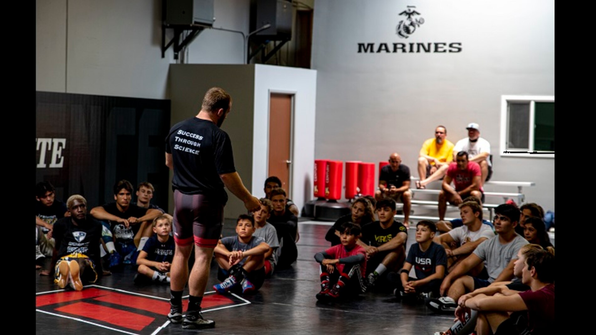 Kyle Snyder, 2016 Olympic gold medalist and 4x world wrestling champion, speaks to participants during a wrestling clinic at The Treigning Lab, in Orange County, Calif. on July 25, 2020. The Treigning Lab hosted a wrestling clinic led by the...