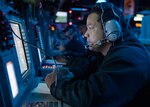 201104-N-RG171-0124 MEDITERRANEAN SEA (Nov. 4, 2020) Ensign Frank Butler operates a console in the combat information center aboard the Arleigh Burke-class guided-missile destroyer USS Donald Cook (DDG 75), Nov. 4, 2020. Donald Cook, forward-deployed to Rota, Spain, is on its 11th patrol in the U.S. Sixth Fleet area of operations in support of regional allies and partners and U.S. national security in Europe and Africa. (U.S. Navy photo by Mass Communication Specialist 3rd Class Will Hardy/Released)