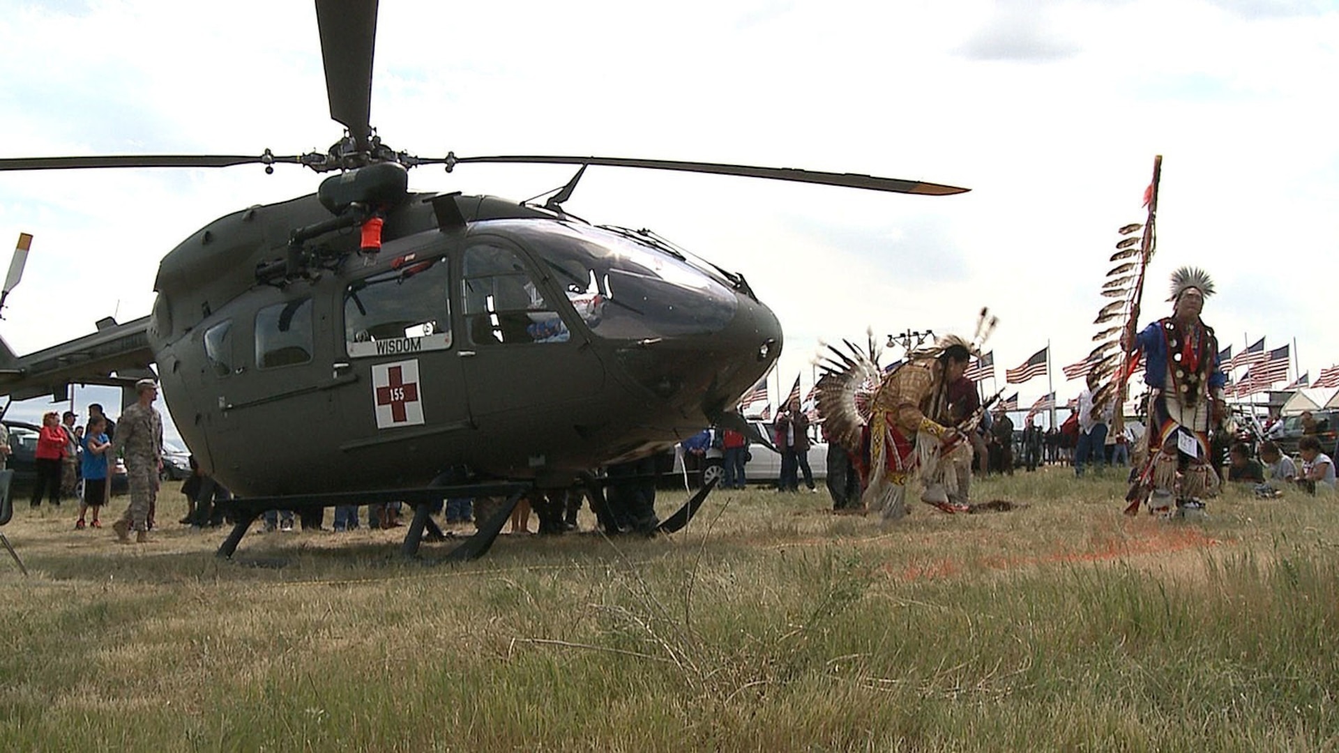 Two members of the Standing Rock Sioux Nation dance in traditional attire around a South Dakota Army National Guard UH 72 Lakota helicopter on June 10, 2012 after a blessing ceremony for the helicopter. The SDNG and the Lakota Nation have partnered together to support the people living on the reservations as well as to help inspire the youth to become active members of the community.
