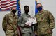 Airman accepts prize.