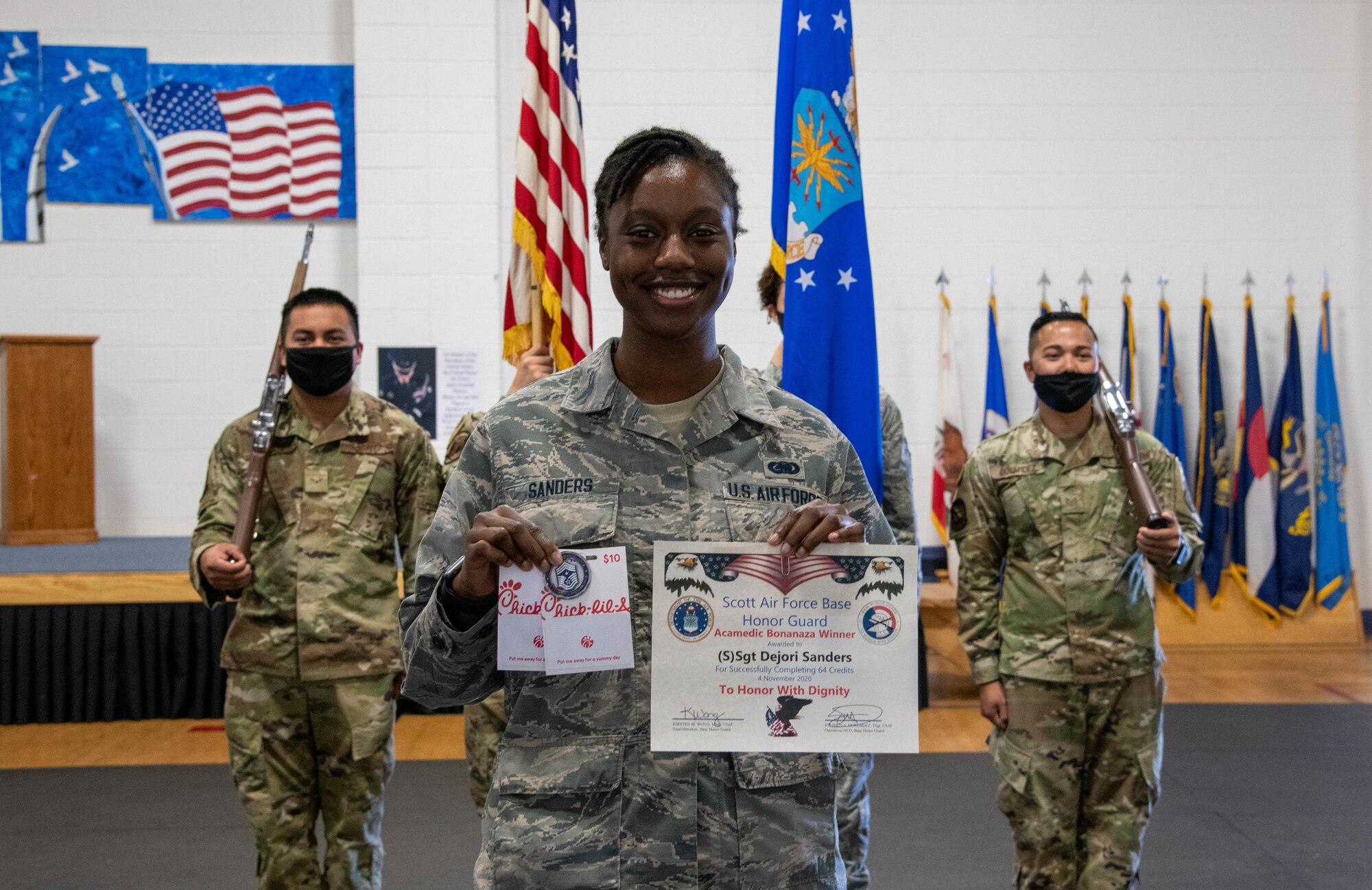 Airman holding prize.