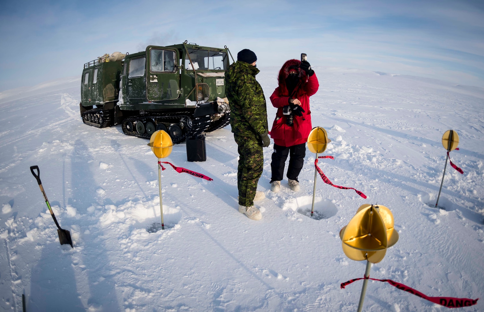 Canadian Armed Forces members set up satellite targets in ice, snow in Resolute Bay, Nunavut