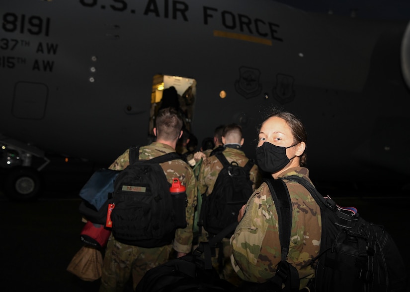 1st Lt. Emily Timinski, a C-17 Globemaster III pilot assigned to the 15th Airlift Squadron, steps into a C-17 for a deployment swap to Al Udeid Air Base, Qatar, at Joint Base Charleston, S.C., Oct. 29, 2020. Airmen assigned to the 15th AS replaced Airmen assigned to the 16th AS, who were returning home after a 90-day deployment. Both squadrons fly and operate C-17s assigned to the 437th Airlift Wing.