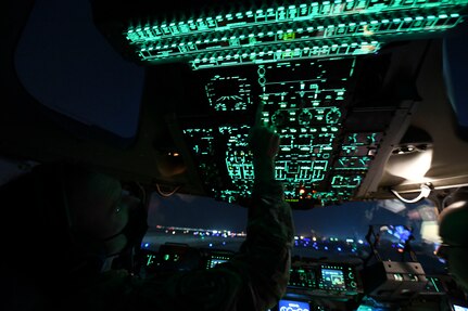 Lt. Col. Jonathan Baize, a C-17 Globemaster III pilot and 15th Airlift Squadron commander, prepares a C-17 for takeoff at Ali Al Salem Air Base, Kuwait, Oct. 30, 2020. Airmen assigned to the 15th AS replaced Airmen assigned to the 16th AS, who were returning home after a 90-day deployment. Both squadrons fly and operate C-17s assigned to the 437th Airlift Wing located at Joint Base Charleston, S.C.