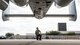 A photo of an Airman doing pre-flight inspections
