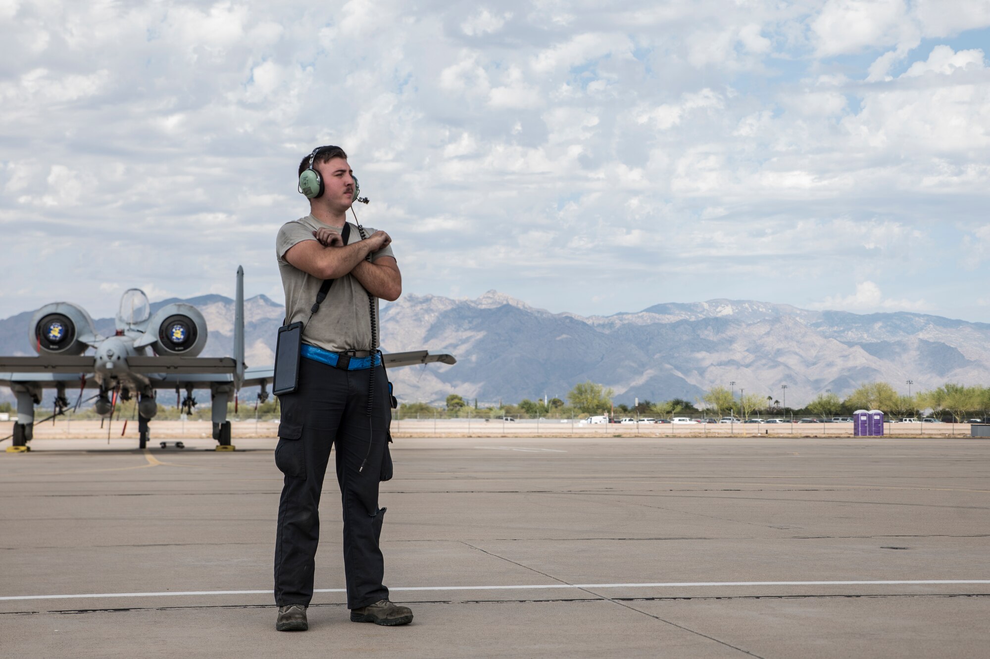 A photo of an Airman doing pre-flight inspections