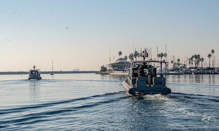 Sailors assigned to Maritime Expeditionary Security Squadron (MSRON) 11, underway aboard a Sea Ark 34-foot patrol boat during a security site survey off the coast of Long Beach in California