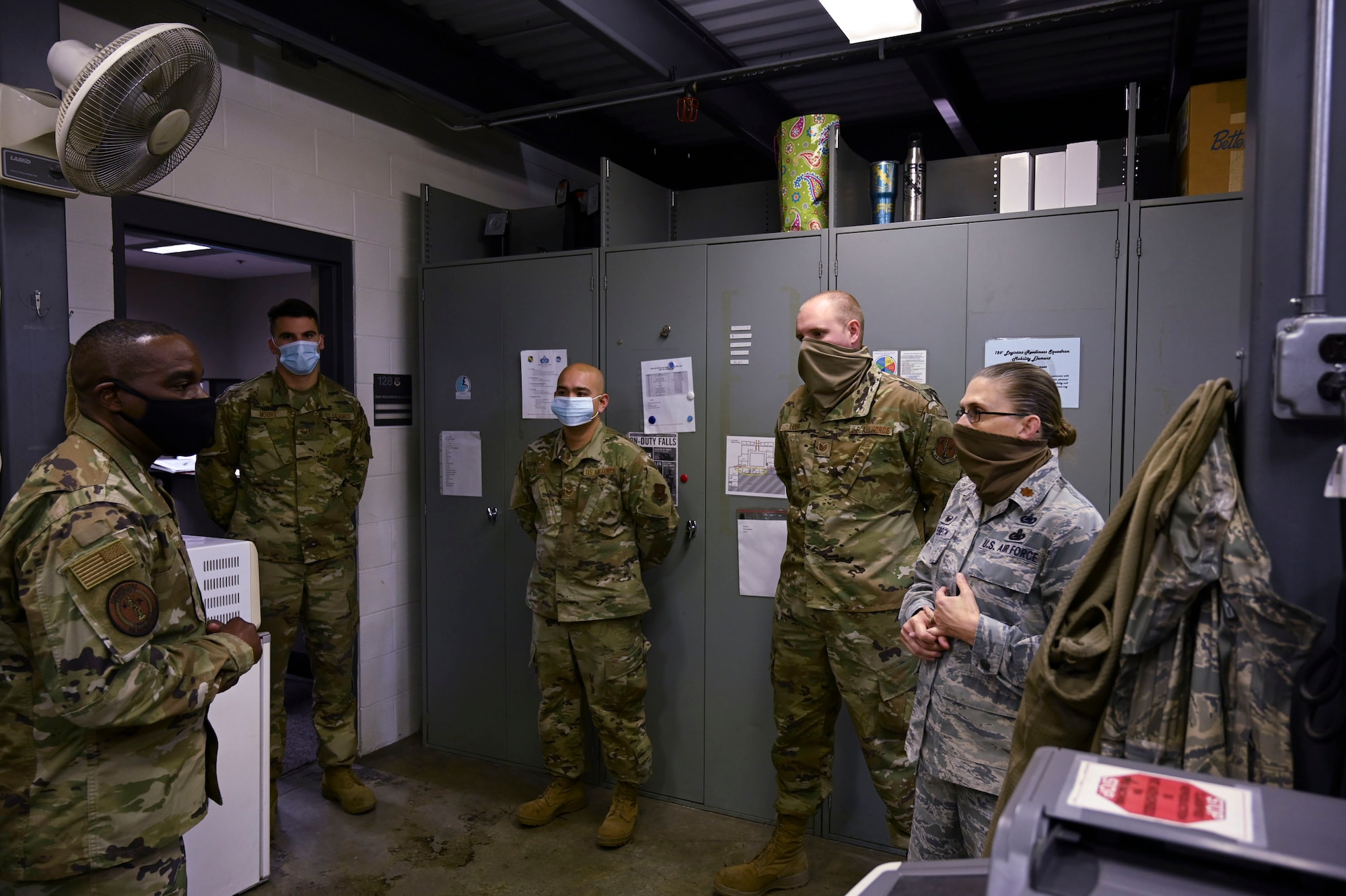 U.S. Air Force Chief Master Sgt. Maurice Williams, command chief master sergeant of the Air National Guard, and Maj. Jennifer Luebeck, commander of the 126th Logistics Readiness Squadron, talk with Staff Sgt. Richard Moore, Staff Sgt. Benson Mantes, and Tech. Sgt. Jacbo Lider, all with the war readiness shop at the squadron, during the chief's visit to Scott Air Force Base, Illinois, Oct. 27, 2020.