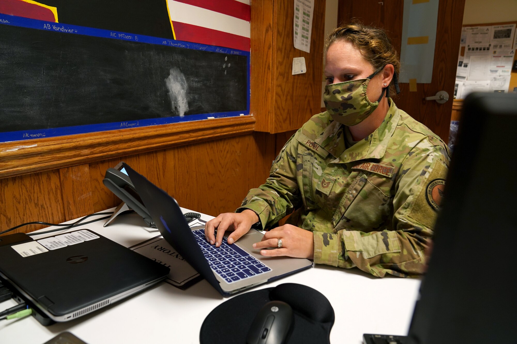 U.S. Air Force Tech. Sgt. Kathy Pool, 335th Training Squadron Personnel Apprentice Course instructor, reviews course material on her laptop inside Wolfe Hall at Keesler Air Force Base, Mississippi, November 3, 2020. The 335th TRS tested the Direct to Duty Technical Training program on a class of prior-service students, aiming to save money and time, keep the students safe and healthy and allow them to stay with their families. (U.S. Air Force photo by Airman 1st Class Seth Haddix)