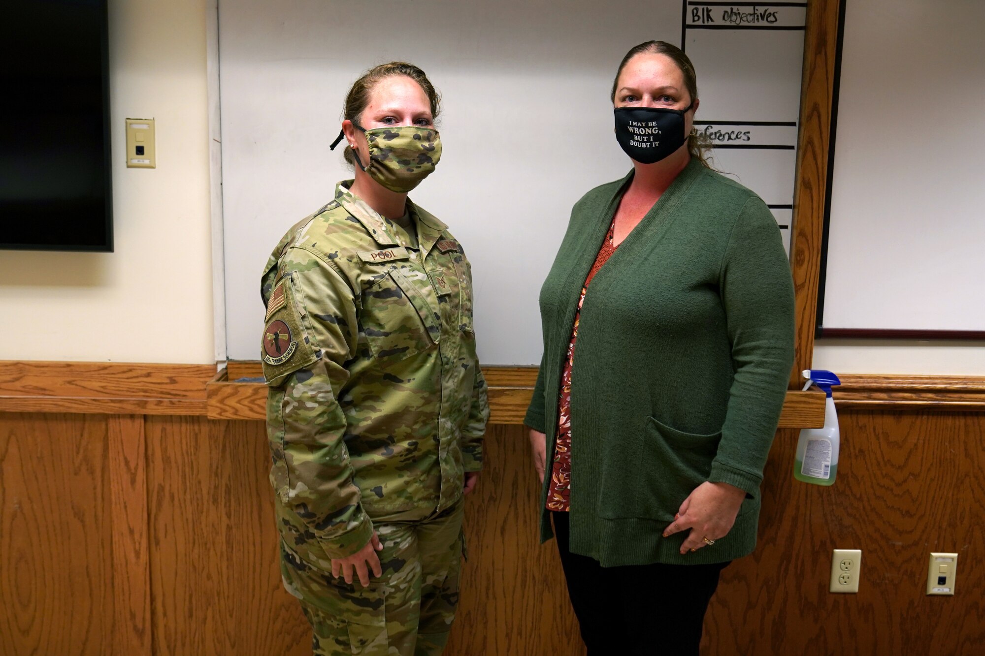 U.S. Air Force Tech. Sgt. Kathy Pool, 335th Training Squadron Personnel Apprentice Course instructor, and Jennifer DesJardin, 335th TRS PAC instructor supervisor, pose for a photo inside Wolfe Hall at Keesler Air Force Base, Mississippi, November 3, 2020. The 335th TRS tested the Direct to Duty Technical Training program on a class of prior-service students, aiming to save money and time, keep the students safe and healthy and allow them to stay with their families. (U.S. Air Force photo by Airman 1st Class Seth Haddix)