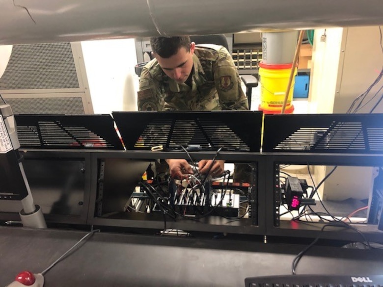 1st Lt. Tyler Despard works on hardware upgrades to the Supersonic Rain Erosion Test Rig. (U.S. Air Force photo/Greg Lanchman)