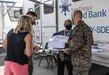 May Goldman, middle, a volunteer with the San Diego Blood Bank, explains the blood donation paperwork to U.S. Marine Corps Col. Christian Ellinger, Inspector General with Western Recruiting Region and Col. Rob Hancock, Assistant Chief of Staff, WRR, during a blood drive in memory of Lyanna Fernandez at Marine Corps Recruit Depot San Diego, Oct. 7.