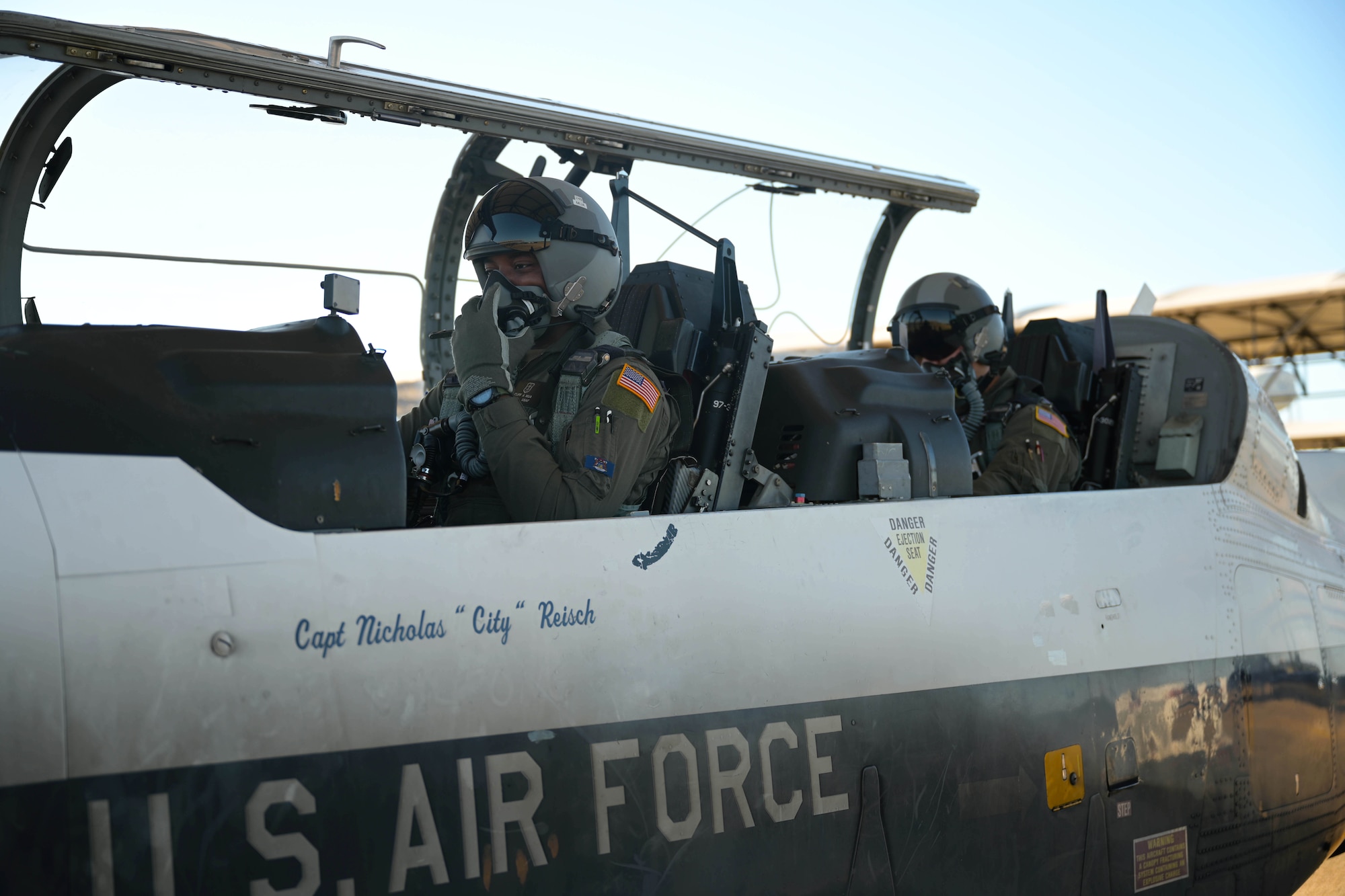 U.S. Air Force 2nd Lt. Clifford Mua (left), 41st Flying Training Squadron student pilot, and Maj. Samuel Berryhill, 41st Flying Training Squadron instructor pilot, begin flight preparations in the T-6 Texan II Nov. 4, 2020, on Columbus Air Force Base Miss. The T-6 aircraft is part of the second phase of Specialize Undergraduate Pilot Training where students learn aircraft flight characteristics, emergency procedures, takeoff and landing procedures, aerobatics and formation flying. (U.S. Air Force photo by Senior Airman Jake Jacobsen)