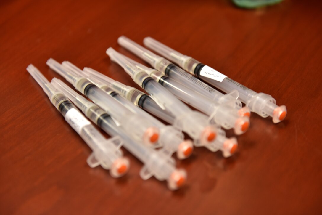 Flu shots sit on a table ready to be dispersed in the Norma Brown Building on Goodfellow Air Force Base, Texas, Nov. 2, 2020. The table was disinfected and masks were worn to ensure proper adherence to Centers for Disease Control and Prevention guidelines. (U.S. Air Force photo by Staff Sgt. Seraiah Wolf)