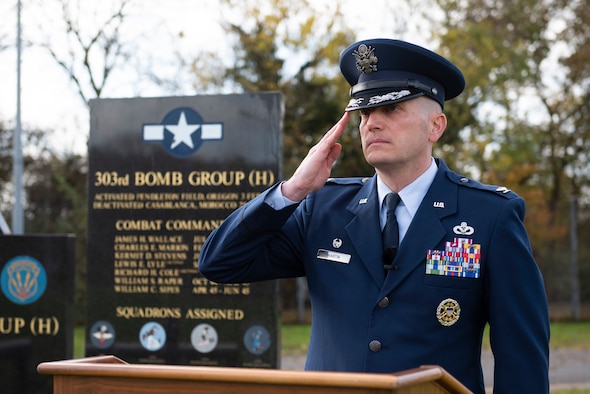 Royal Air Force Sqn. Ldr. Clive Wood, RAF Alconbury and RAF Molesworth RAF commander, reads an excerpt from the poem “For the Fallen,” by Robert Laurence Binyon, during a Remembrance Sunday ceremony near the 303rd Bombardment Group monument at RAF Molesworth, England, Nov. 3, 2020. Remembrance Sunday is commemorated the second Sunday every November to honor the service and sacrifice of Armed Forces, British and Commonwealth veterans, as well as the Allies that fought alongside them in the two World Wars and later conflicts. (U.S. Air Force photo by Senior Airman Jennifer Zima)