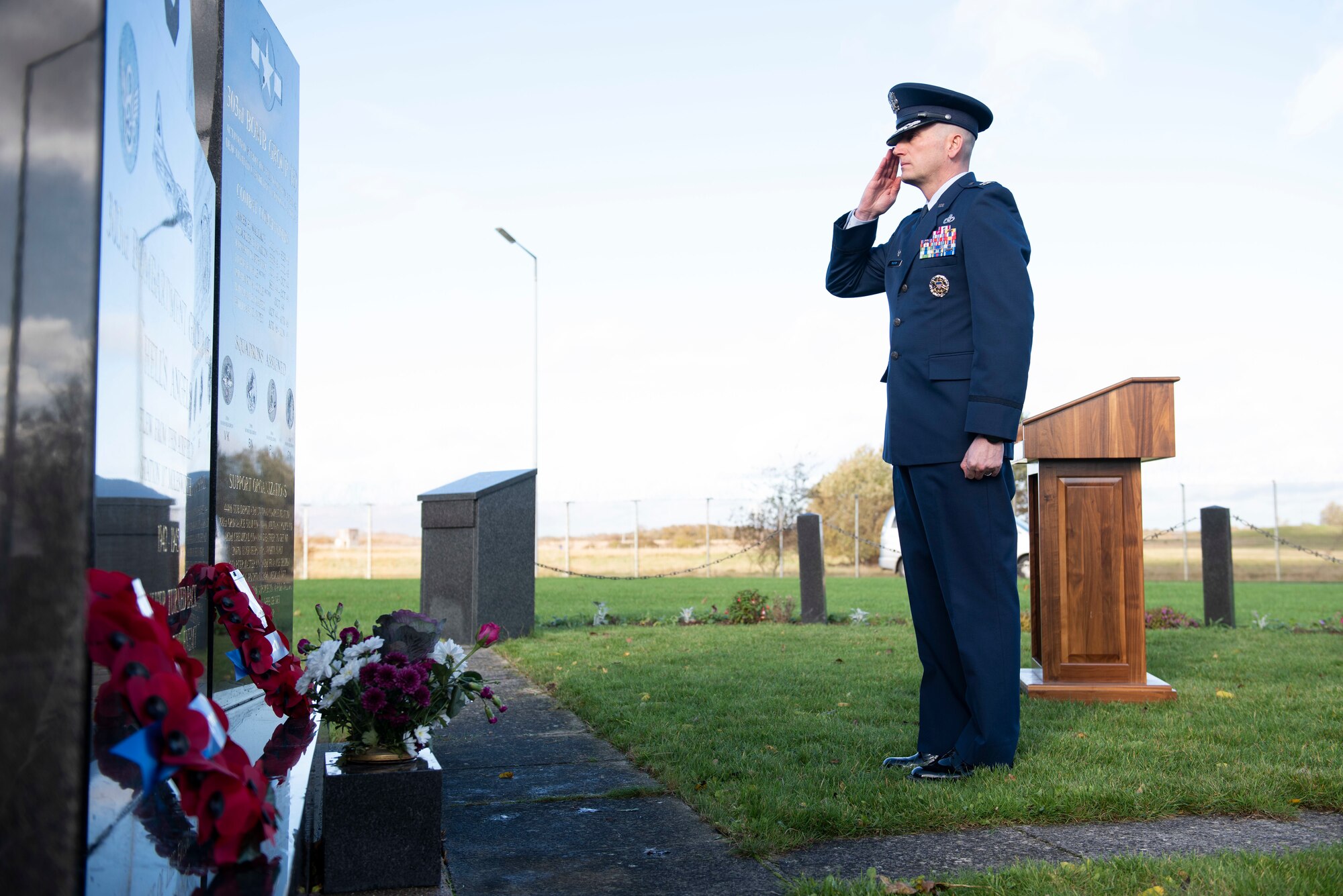 U.S. Air Force Col. Richard Martin, 423rd Air Base Group commander, salutes during a Remembrance Sunday ceremony near the 303rd Bombardment Group memorial monument at RAF Molesworth, England, Nov. 3, 2020. Remembrance Sunday is commemorated the second Sunday every November to honor the service and sacrifice of Armed Forces, British and Commonwealth veterans, as well as the Allies that fought alongside them in the two World Wars and later conflicts. (U.S. Air Force photo by Senior Airman Jennifer Zima)