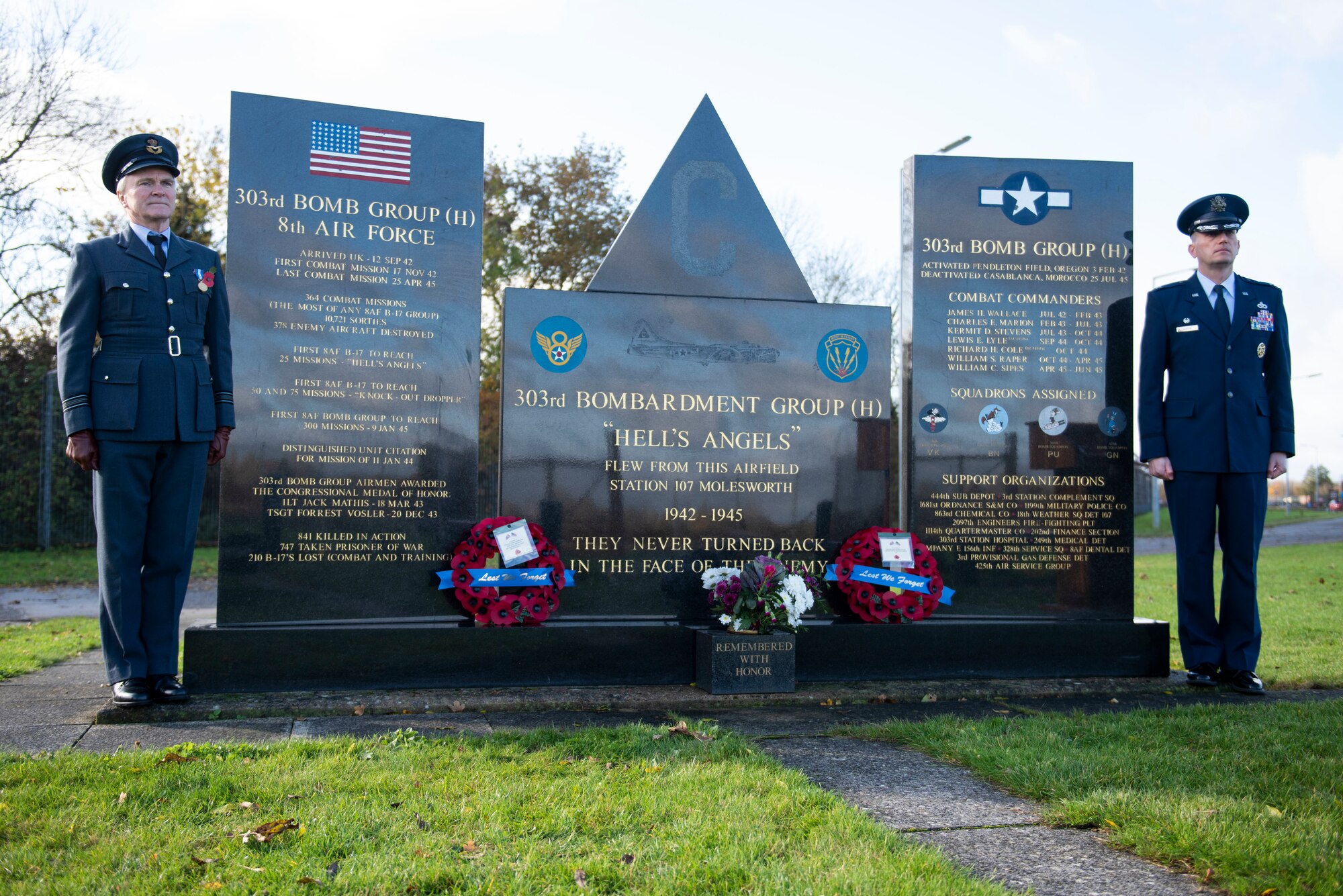 Royal Air Force Sqn. Ldr. Clive Wood, left, RAF Alconbury and RAF Molesworth RAF commander, and U.S. Air Force Col. Richard Martin, right, 423rd Air Base Group commander, stand near the World War II memorial during a Remembrance Sunday ceremony at the 303rd Bombardment Group memorial monument at RAF Molesworth, England, Nov. 3, 2020. Remembrance Sunday is commemorated the second Sunday every November to honor the service and sacrifice of Armed Forces, British and Commonwealth veterans, as well as the Allies that fought alongside them in the two World Wars and later conflicts. (U.S. Air Force photo by Senior Airman Jennifer Zima)