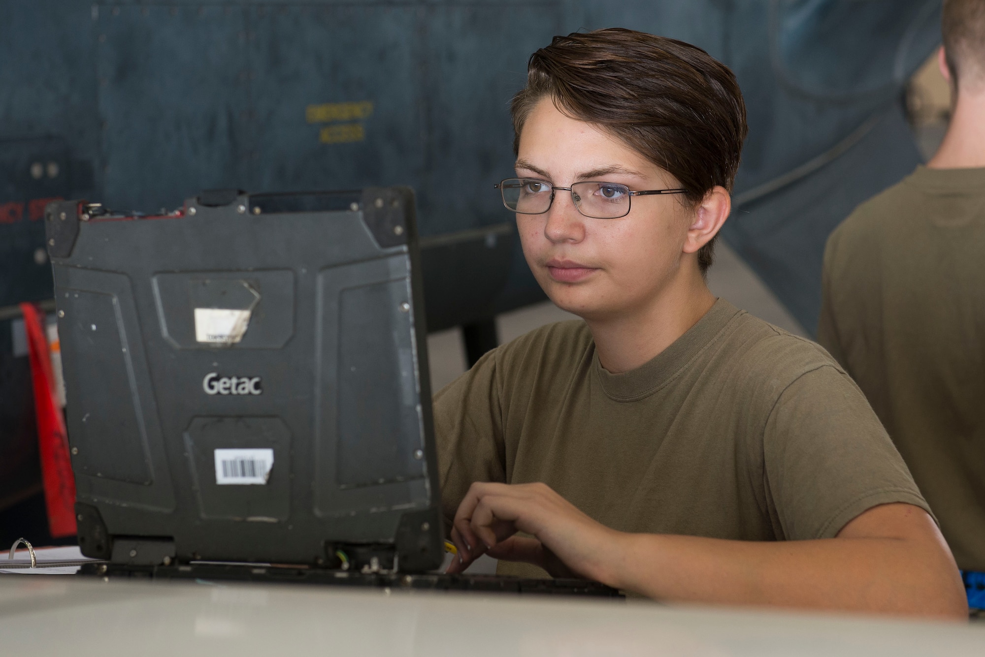 U.S. Air Force Airman 1st Class Krystal Adamson, 380th Expeditionary Aircraft Maintenance Squadron crew chief, reviews technical orders during routine maintenance on an RQ-4 Global Hawk unmanned aerial vehicle at Al Dhafra Air Base, United Arab Emirates, Nov. 3, 2020.