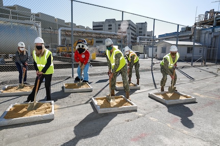 Norfolk Naval Shipyard (NNSY) held a groundbreaking ceremony for a new Industrial Wastewater Treatment Plant (IWTP) Nov. 4. The participants in the ceremony were front row participants, left to right, were Nicole Bulgarino, Ameresco, Executive Vice President, RDML Howard Markle, Commander, NNSY, and Public Works Officer, Capt. Bill Butler. The back row, left to right, Jill Wild, Director, Code 106, NNSY’s Mascot, Yardbird Sam, ENS Marc Rappe, Construction Manager. The IWTP is part of an Energy Savings Performance Contract (ESPC) that will provide critical energy and infrastructure upgrades and improve energy efficiency at NNSY. This project is a part of the Shipyard Infrastructure Optimization Program (SIOP), a 20-year, $21 billion program dedicated to completely refurbishing the nation’s four public shipyards by modernizing equipment, improving workflow and upgrading dry docks and facilities.