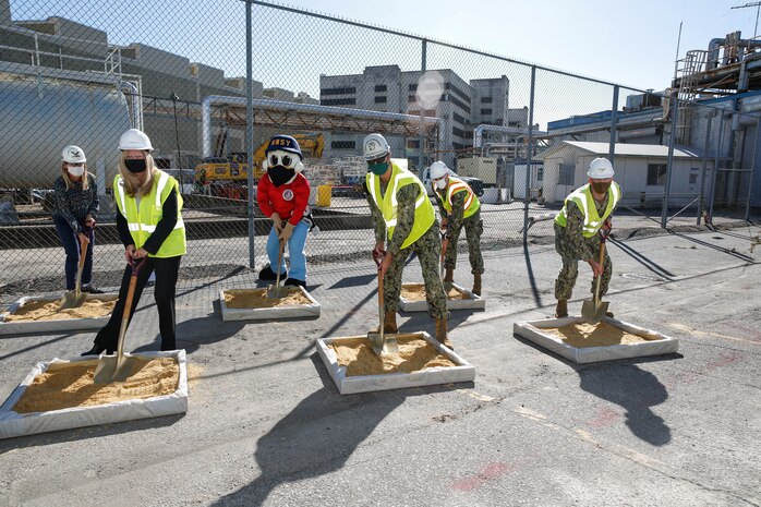 Norfolk Naval Shipyard (NNSY) held a groundbreaking ceremony for a new Industrial Wastewater Treatment Plant (IWTP) Nov. 4. The participants in the ceremony were front row participants, left to right, were Nicole Bulgarino, Ameresco, Executive Vice President, RDML Howard Markle, Commander, NNSY, and Public Works Officer, Capt. Bill Butler. The back row, left to right, Jill Wild, Director, Code 106, NNSY’s Mascot, Yardbird Sam, ENS Marc Rappe, Construction Manager. The IWTP is part of an Energy Savings Performance Contract (ESPC) that will provide critical energy and infrastructure upgrades and improve energy efficiency at NNSY. This project is a part of the Shipyard Infrastructure Optimization Program (SIOP), a 20-year, $21 billion program dedicated to completely refurbishing the nation’s four public shipyards by modernizing equipment, improving workflow and upgrading dry docks and facilities.