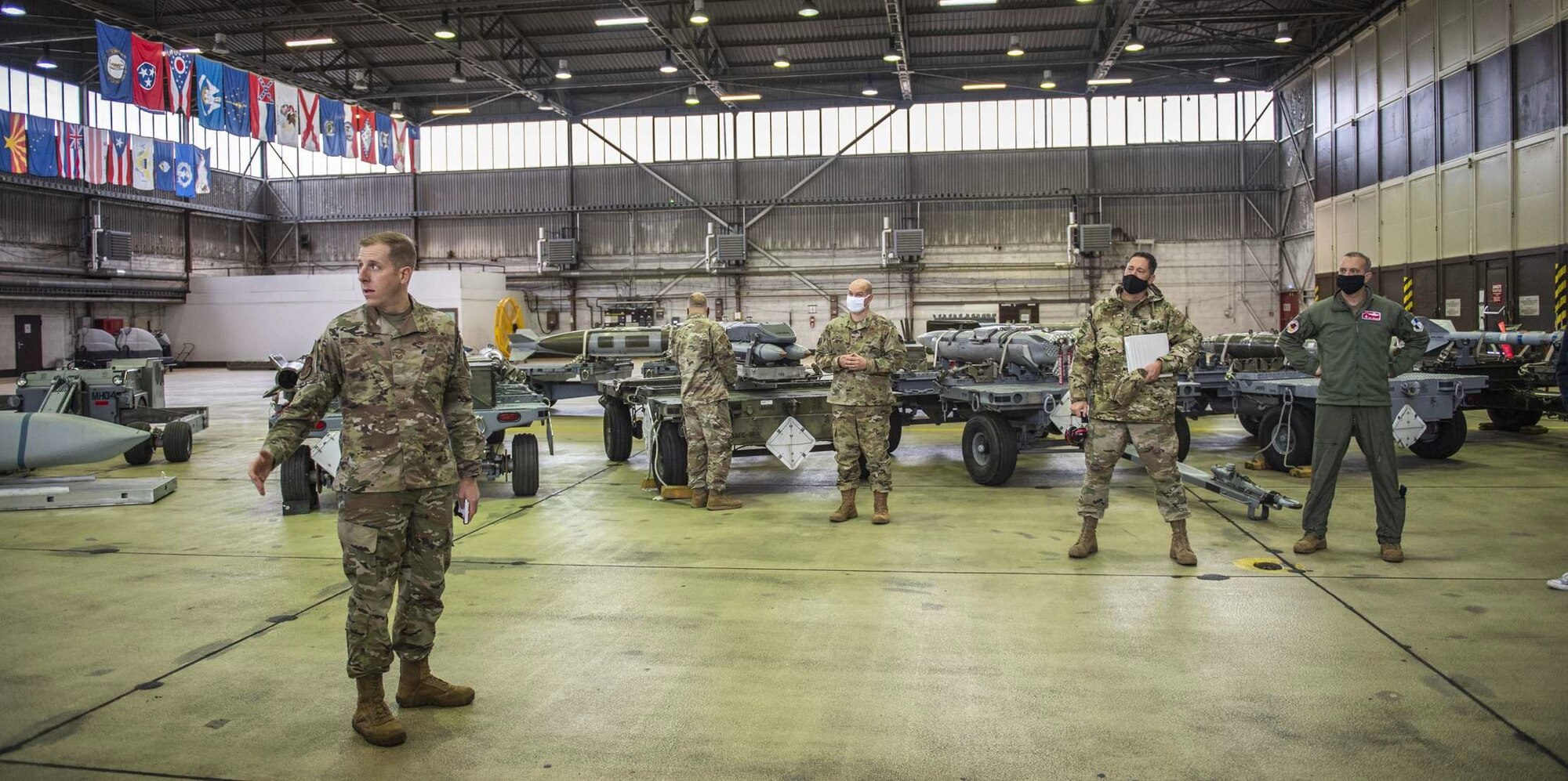 U.S. Air Force Tech. Sgt. Tyler Ward, 52nd Maintenance Squadron flightline expediter, briefs Airmen and participants of the Civilian Leadership Development Program on the maintenance of an F-16 Fighting Falcon and its weapons at Spangdahlem Air Base, Germany, Oct. 6, 2020. The CLDP is an annual program designed to enhance the professional development of civilian personnel within the USAFE-AFAFRICA area of responsibility. (U.S. Air Force photo by Airman 1st Class Alison Stewart)
