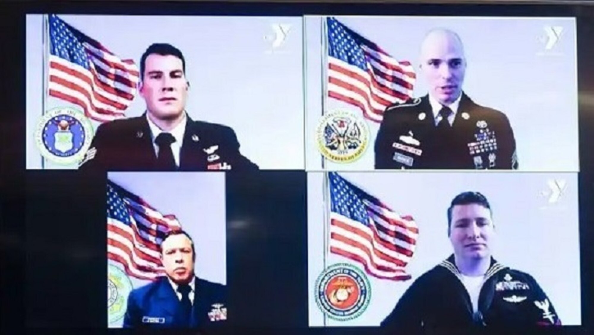 Image of four service members.