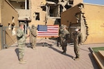 U.S. Army Staff Sgt. A. Jared Forst and Sgt. Becca Meerwarth take their oath of reenlistment Oct. 30, 2020, in Kuwait.