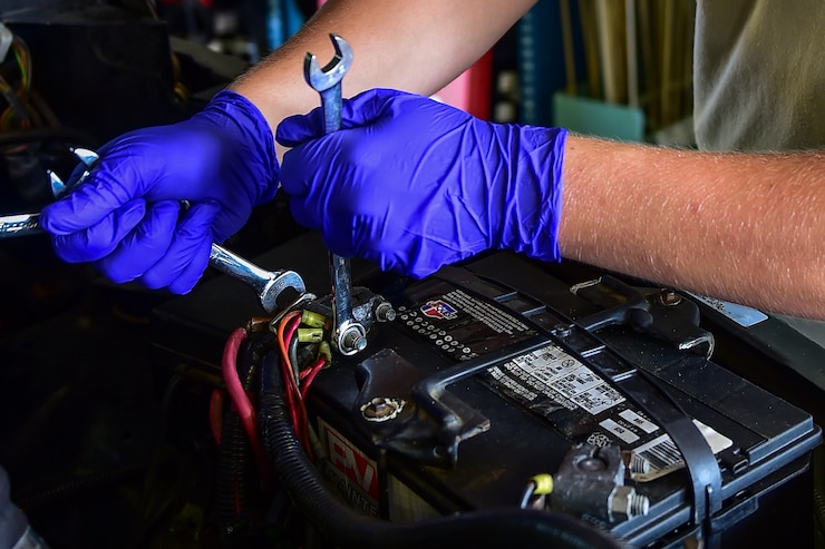Airman Kyle Daly, 1st Special Operations Logistics Readiness Squadron vehicle mechanic apprentice, secures the connections on a battery during a routine battery replacement on Hurlburt Field, Fla., Aug. 3, 2015. The vehicle maintenance flight is responsible for keeping the base’s vehicle fleet in-service at all times for use during training and flight line maintenance operations. (U.S. Air Force photo/Senior Airman Jeff Parkinson)