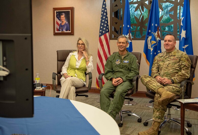 U.S. Air Force Gen. Ken Wilsbach, Pacific Air Forces (PACAF) commander, center, Chief Master Sgt. David Wolfe, PACAF Command Chief, and Cindy Wilsbach, spouse of Gen. Ken Wilsbach, share key focus areas and lessons learned with commanders, senior enlisted leaders and their spouses from PACAF’s area of responsibility, during the fall commander’s conference, Joint Base Pearl Harbor-Hickam, Hawaii, Oct. 22, 2020. Due to on-going COVID-19 risk mitigation measures, PACAF leaders held the conference virtually. (U.S. Air Force photo by Tech. Sgt. Zach Vaughn)